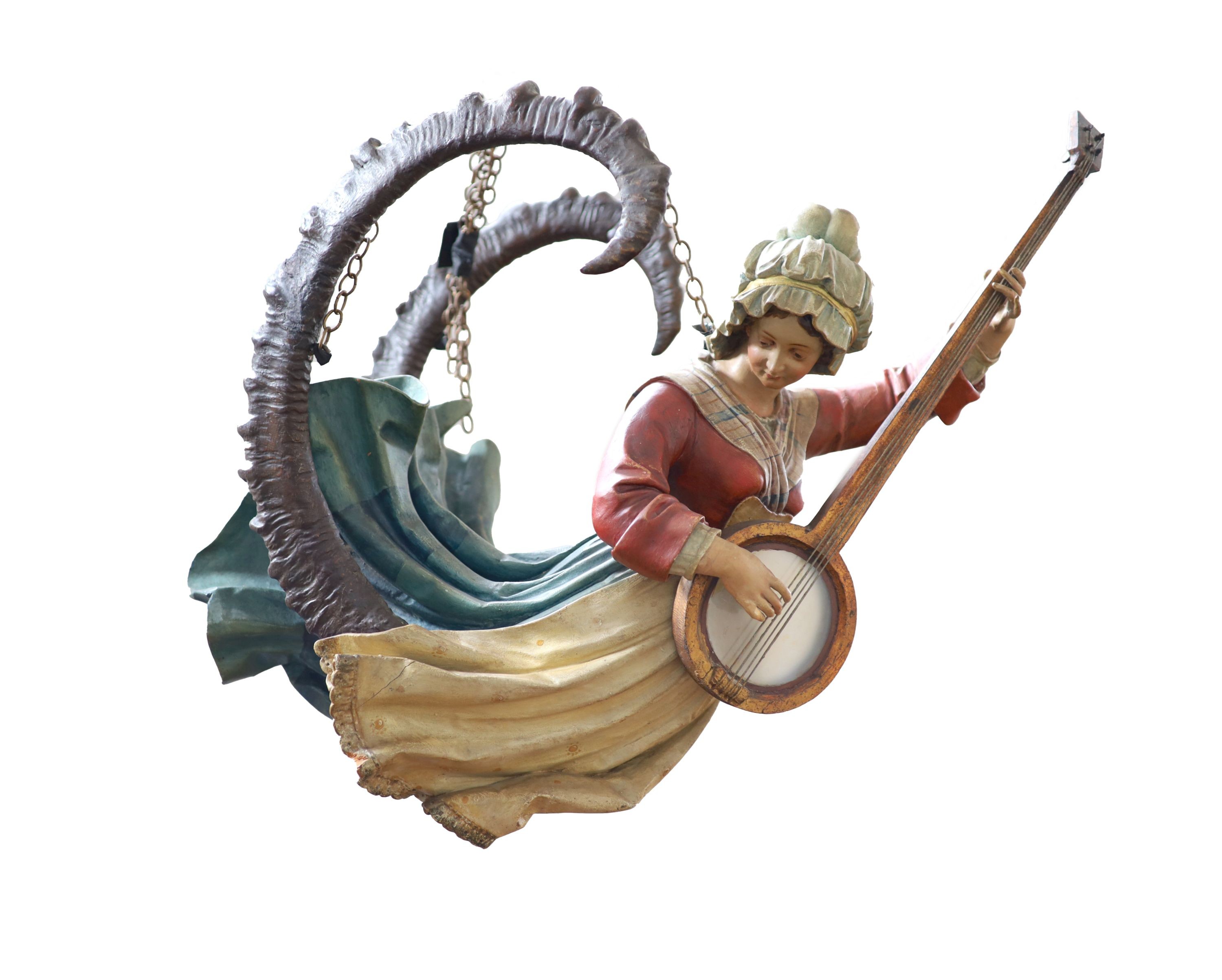 A late 19th century carved and painted wood Lusterweibchen H 60cm. W 80cm.